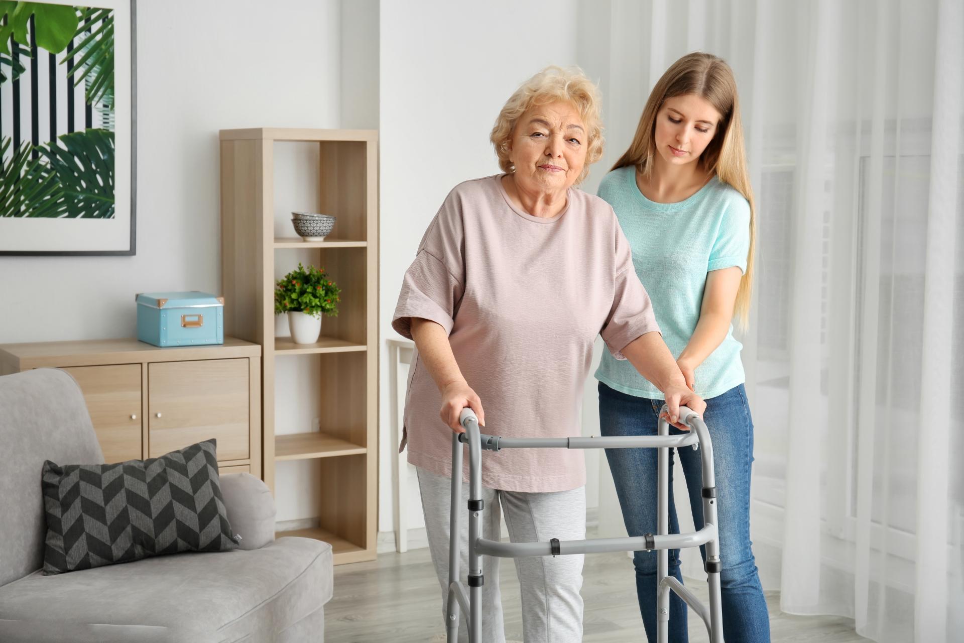 Caregiver helping elderly lady